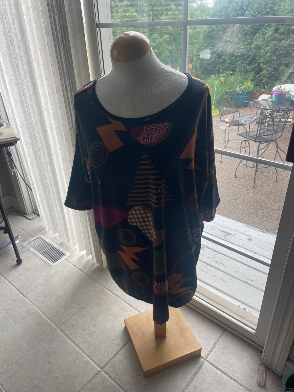 LuLaRoe Black Tunic with Multicolor Geometric Print